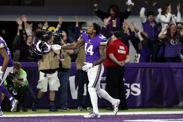 CORRECTS SPELLING TO DIGGS NOT RIGGS Minnesota Vikings wide receiver Stefon Diggs (14) celebrates in the end zone after a game winning touchdown against the New Orleans Saints during the second half of an NFL divisional football playoff game in Minneapolis, Sunday, Jan. 14, 2018. The Vikings defeated the Saints 29-24. (AP Photo/Jeff Roberson)