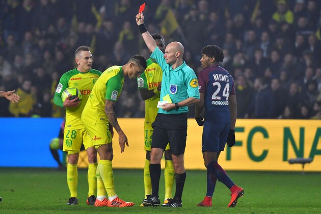 Nantes' Brazilian defender Diego Carlos (C) receives a red card from French referee Tony Chapron during the French L1 football match between Nantes and Paris Saint-Germain (Paris-SG) at the La Beaujoire stadium in Nantes, western France, on January 14, 2018.     / AFP PHOTO / LOIC VENANCE        (Photo credit should read LOIC VENANCE/AFP/Getty Images)