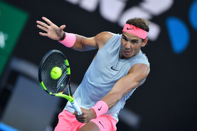 Spain's Rafael Nadal hits a return against Dominican Republic's Victor Estrella Burgos during their men's singles first round match on day one of the Australian Open tennis tournament in Melbourne on January 15, 2018. / AFP PHOTO / Greg Wood / -- IMAGE RESTRICTED TO EDITORIAL USE - STRICTLY NO COMMERCIAL USE --        (Photo credit should read GREG WOOD/AFP/Getty Images)