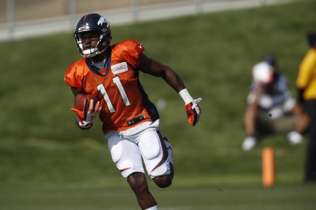 Denver Broncos wide receiver Carlos Henderson (11) takes part in drills at an NFL football training camp Sunday, July 30, 2017, in Englewood, Colo. (AP Photo/David Zalubowski)