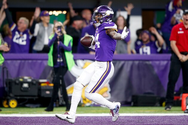 MINNEAPOLIS, MN - JANUARY 14:  Stefon Diggs #14 of the Minnesota Vikings celebrates after scoring a touchdown to defeat the New Orleans Saints in the NFC Divisional Playoff game at U.S. Bank Stadium on January 14, 2018 in Minneapolis, Minnesota.  (Photo by Jamie Squire/Getty Images)