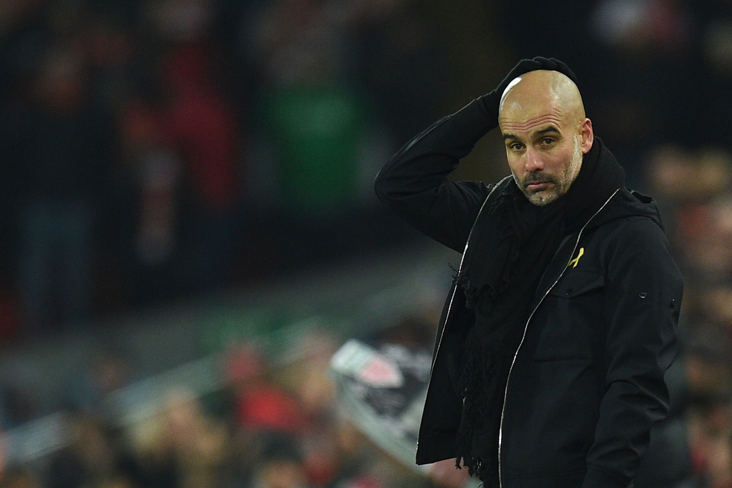 Manchester City's Spanish manager Pep Guardiola reacts on the touchline during the English Premier League football match between Liverpool and Manchester City at Anfield in Liverpool, north west England on January 14, 2018. / AFP PHOTO / Oli SCARFF / RESTRICTED TO EDITORIAL USE. No use with unauthorized audio, video, data, fixture lists, club/league logos or 'live' services. Online in-match use limited to 75 images, no video emulation. No use in betting, games or single club/league/player publications. / (Photo credit should read OLI SCARFF/AFP/Getty Images) Manchester City's Spanish manager Pep Guardiola reacts on the touchline during the English Premier League football match between Liverpool and Manchester City at Anfield in Liverpool, north west England on January 14, 2018. / AFP PHOTO / Oli SCARFF / RESTRICTED TO EDITORIAL USE. No use with unauthorized audio, video, data, fixture lists, club/league logos or 'live' services. Online in-match use limited to 75 images, no video emulation. No use in betting, games or single club/league/player publications. / (Photo credit should read OLI SCARFF/AFP/Getty Images)
