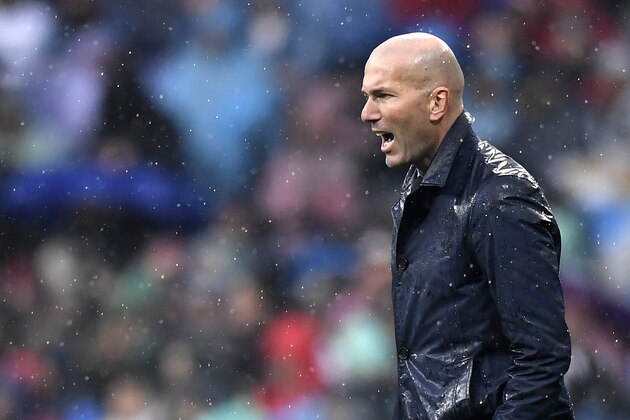 Real Madrid's French coach Zinedine Zidane reacts during the Spanish league football match between Real Madrid and Villarreal at the Santiago Bernabeu Stadium in Madrid on January 13, 2018. / AFP PHOTO / GABRIEL BOUYS        (Photo credit should read GABRIEL BOUYS/AFP/Getty Images)