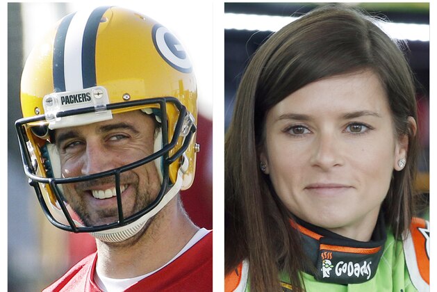 FILE - In this July 30, 2015, file photo, Green Bay Packers' Aaron Rodgers, left, smiles during NFL football training camp in Green Bay, Wis.; and in this May 23, 2015, file photo, NASCAR driver Danica Patrick waits by her car in Charlotte, N.C. Patrick, a noted Chicago Bears fan, confirmed Monday. Jan. 15, 2018, she is dating Rodgers.  (AP Photo/ Morry Gash, left, and Chris Keane, right, File)