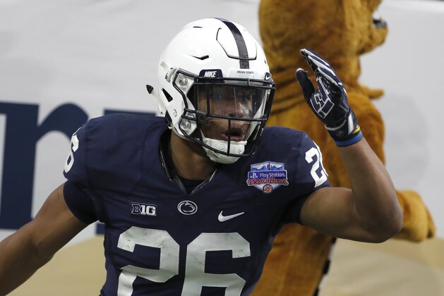 Penn State running back Saquon Barkley (26) against Washington during the Fiesta Bowl NCAA college football game, Saturday, Dec. 30, 2017, in Glendale, Ariz. (AP Photo/Rick Scuteri)