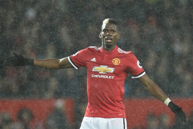 Manchester United's French midfielder Paul Pogba is seen during the English Premier League football match between Manchester United and Stoke City at Old Trafford in Manchester, north west England, on January 15, 2018. / AFP PHOTO / Oli SCARFF / RESTRICTED TO EDITORIAL USE. No use with unauthorized audio, video, data, fixture lists, club/league logos or 'live' services. Online in-match use limited to 75 images, no video emulation. No use in betting, games or single club/league/player publications.  /         (Photo credit should read OLI SCARFF/AFP/Getty Images)