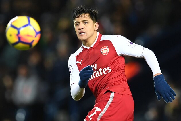 Arsenal's Chilean striker Alexis Sanchez watches the ball during the English Premier League football match between West Bromwich Albion and Arsenal at The Hawthorns stadium in West Bromwich, central England, on December 31, 2017.
 / AFP PHOTO / Paul ELLIS / RESTRICTED TO EDITORIAL USE. No use with unauthorized audio, video, data, fixture lists, club/league logos or 'live' services. Online in-match use limited to 75 images, no video emulation. No use in betting, games or single club/league/player publications.  /         (Photo credit should read PAUL ELLIS/AFP/Getty Images)