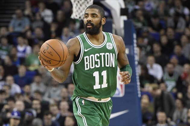 LONDON, ENGLAND - JANUARY 11: Kyrie Irving #11 of the Boston Celtics handles the ball against the Philadelphia 76ers during the 2018 NBA London Game at the 02 Arena on January 11, 2018 in London, England. NOTE TO USER: User expressly acknowledges and agrees that, by downloading and/or using this Photograph, user is consenting to the terms and conditions of the Getty Images License Agreement. Mandatory Copyright Notice: Copyright 2018 NBAE (Photo by Brian Babineau/NBAE via Getty Images)