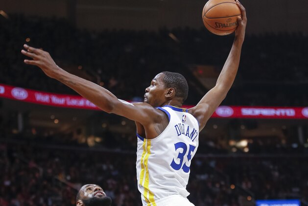 CLEVELAND, OH - JANUARY 15: Kevin Durant #35 of the Golden State Warriors goes up for the dunk over LeBron James #23 of the Cleveland Cavaliers at Quicken Loans Arena on January 15, 2018 in Cleveland, Ohio. NOTE TO USER: User expressly acknowledges and agrees that, by downloading and or using this photograph, User is consenting to the terms and conditions of the Getty Images License Agreement. (Photo by Michael Hickey/Getty Images)