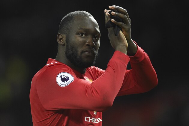 Manchester United's Belgian striker Romelu Lukaku applauds the fans at the end of the English Premier League football match between Manchester United and Stoke City at Old Trafford in Manchester, north west England, on January 15, 2018. / AFP PHOTO / Oli SCARFF / RESTRICTED TO EDITORIAL USE. No use with unauthorized audio, video, data, fixture lists, club/league logos or 'live' services. Online in-match use limited to 75 images, no video emulation. No use in betting, games or single club/league/player publications.  /         (Photo credit should read OLI SCARFF/AFP/Getty Images)