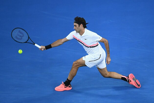 MELBOURNE, AUSTRALIA - JANUARY 16:  Roger Federer of Switzerland plays a forehand in his first round match against Aljaz Bedene of Slovenia on day two of the 2018 Australian Open at Melbourne Park on January 16, 2018 in Melbourne, Australia.  (Photo by Quinn Rooney/Getty Images)
