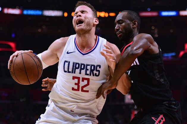 LOS ANGELES, CA - JANUARY 15:  Blake Griffin #32 of the LA Clippers reacts as he posts up Luc Mbah a Moute #12 of the Houston Rockets during a 113-102 Clipper win at Staples Center on January 15, 2018 in Los Angeles, California.  (Photo by Harry How/Getty Images)
