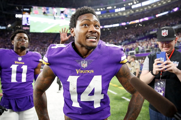 MINNEAPOLIS, MN - JANUARY 14:  Stefon Diggs #14 of the Minnesota Vikings celebrates after defeating the New Orleans Saints in the NFC Divisional Playoff game at U.S. Bank Stadium on January 14, 2018 in Minneapolis, Minnesota.  (Photo by Jamie Squire/Getty Images)
