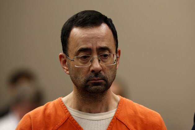 Former Michigan State University and USA Gymnastics doctor Larry Nassar appears at Ingham County Circuit Court on November 22, 2017 in Lansing, Michigan.  
Former USA Gymnastics team doctor Lawrence (Larry) Nassar, accused of molesting dozens of female athletes over several decades, on Wednesday pleaded guilty to multiple counts of criminal sexual conduct. Nassar -- who was involved with USA Gymnastics for nearly three decades and worked with the country's gymnasts at four separate Olympic Games -- could face at least 25 years in prison on the charges brought in Michigan.
 / AFP PHOTO / JEFF KOWALSKY        (Photo credit should read JEFF KOWALSKY/AFP/Getty Images)