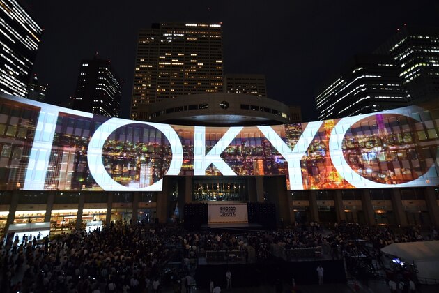 A projection is seen during a ceremony marking three years to go before the start of the Tokyo 2020 Olympic games at the Tokyo Metropolitan Assembly Building on July 24, 2017. 
Japan marked three years before the 2020 Tokyo Olympics on July 24 with celebration and fanfare -- even as organisers struggle to contain soaring costs and restore credibility. / AFP PHOTO / Kazuhiro NOGI        (Photo credit should read KAZUHIRO NOGI/AFP/Getty Images)