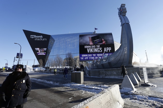 A police officer stands outside U.S. Bank Stadium before an NFL football game between the Minnesota Vikings and the Chicago Bears, Sunday, Dec. 31, 2017, in Minneapolis. (AP Photo/Bruce Kluckhohn)