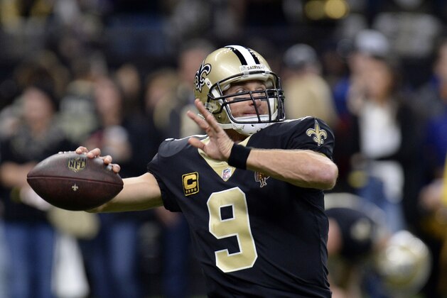 New Orleans Saints quarterback Drew Brees (9) warm up before an NFL football game against the Carolina Panthers in New Orleans, Sunday, Jan. 7, 2018. (AP Photo/Bill Feig)