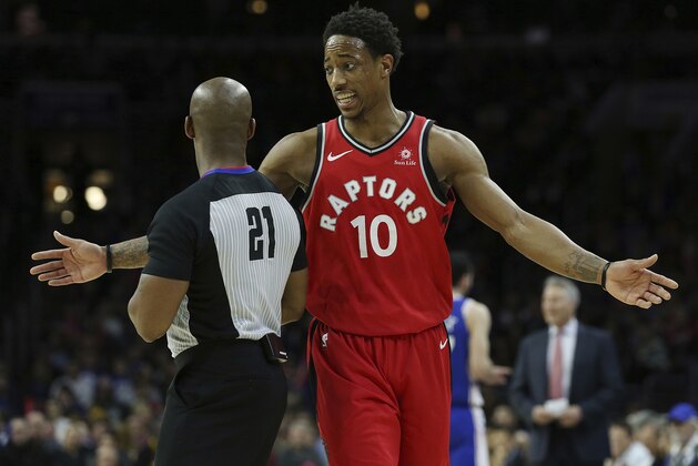 Toronto Raptors guard DeMar DeRozan (10) questions a call by referee Dedric Taylor during an NBA basketball game against the Philadelphia 76ers in Philadelphia, Monday, Jan. 15, 2018. (AP Photo/Rich Schultz)
