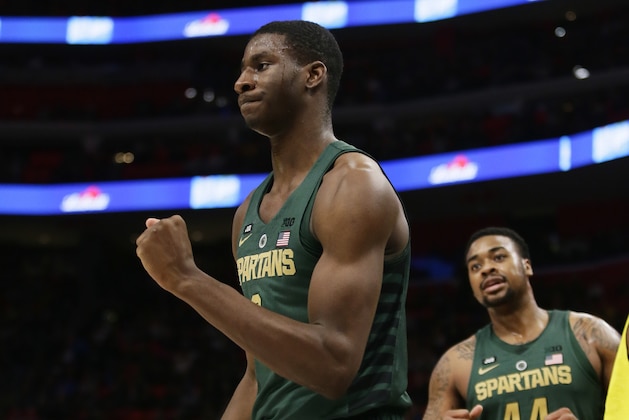 Michigan State forward Jaren Jackson Jr., left, pumps his fist after being fouled and making the shot as teammate Nick Ward (44) looks on during the second half of an NCAA college basketball game against the Oakland Saturday, Dec. 16, 2017, in Detroit. (AP Photo/Duane Burleson)