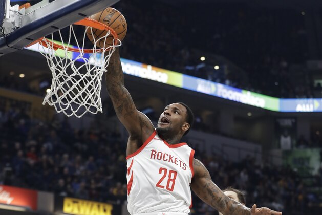 Houston Rockets' Tarik Black dunks during the first half of an NBA basketball game against the Indiana Pacers, Sunday, Nov. 12, 2017, in Indianapolis. (AP Photo/Darron Cummings)