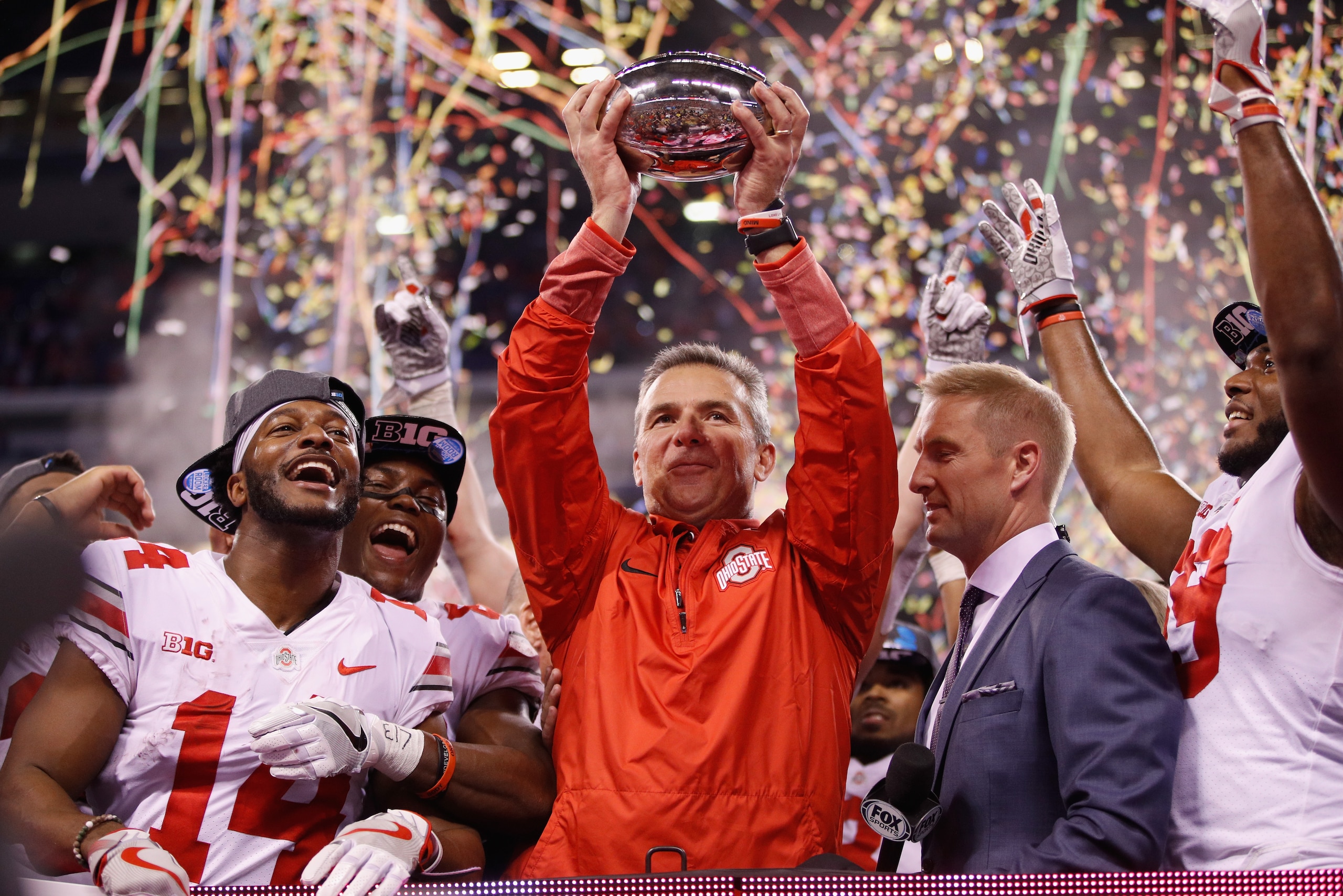 INDIANAPOLIS, IN - DECEMBER 02:  Head coach Urban Meyer of the Ohio State Buckeyes celebrates with the trophy after their 27-21 win over the Wisconsin Badgers during the Big Ten Championship game at Lucas Oil Stadium on December 2, 2017 in Indianapolis, Indiana.  (Photo by Joe Robbins/Getty Images)