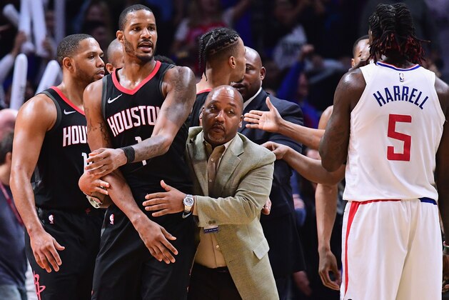 LOS ANGELES, CA - JANUARY 15:  Trevor Ariza #1 of the Houston Rockets is restrained by an assistant coach before his ejection from the game during a 113-102 LA Clippers win at Staples Center on January 15, 2018 in Los Angeles, California.  (Photo by Harry How/Getty Images)