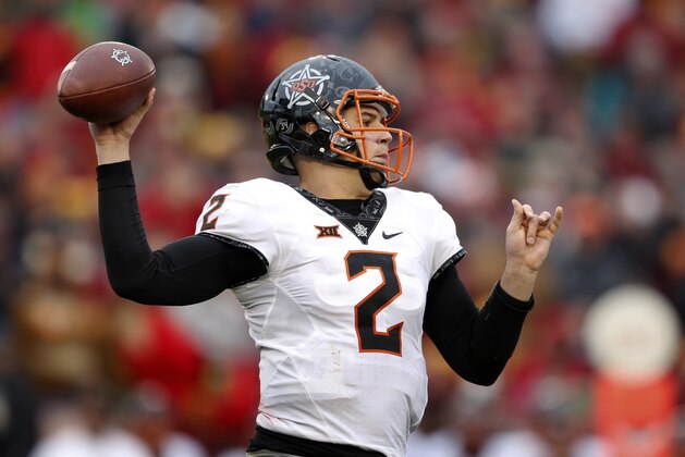 Oklahoma State quarterback Mason Rudolph throws a pass during the second half of an NCAA college football game against Iowa State, Saturday, Nov. 11, 2017, in Ames, Iowa. Oklahoma State won 49-42. (AP Photo/Charlie Neibergall)