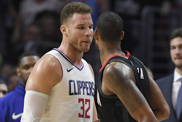 Los Angeles Clippers forward Blake Griffin, left, and Houston Rockets forward Trevor Ariza have words before both of them were ejected in the closing seconds of an NBA basketball game, Monday, Jan. 15, 2018, in Los Angeles. The Clippers won 113-102. (AP Photo/Mark J. Terrill)