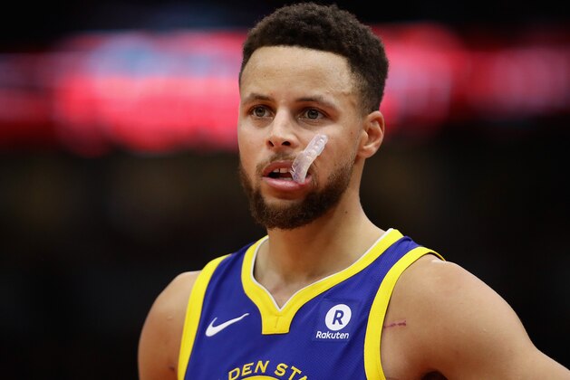 CHICAGO, IL - JANUARY 17:  Stephen Curry #30 of the Golden State Warriors waits for the start of play against the Chicago Bulls at the United Center on January 17, 2018 in Chicago, Illinois. The Warriors defeated the Bulls 119-112. NOTE TO USER: User expressly acknowledges and agrees that, by downloading and or using this photograph, User is consenting to the terms and conditions of the Getty Images License Agreement.  (Photo by Jonathan Daniel/Getty Images)