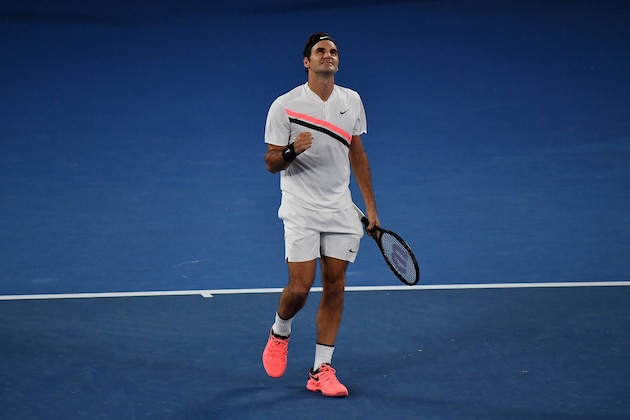 Switzerland's Roger Federer celebrates after victory Germany's Jan-Lennard Struff during their men's singles second round match on day four of the Australian Open tennis tournament in Melbourne on January 18, 2018. / AFP PHOTO / Greg Wood / -- IMAGE RESTRICTED TO EDITORIAL USE - STRICTLY NO COMMERCIAL USE --        (Photo credit should read GREG WOOD/AFP/Getty Images)