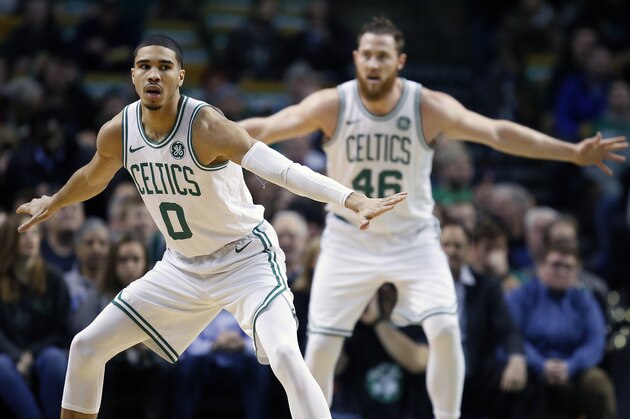 Boston Celtics' Jayson Tatum (0) and Aron Baynes (46) play against the Minnesota Timberwolves during the first quarter of an NBA basketball in Boston, Friday, Jan. 5, 2018. (AP Photo/Michael Dwyer)