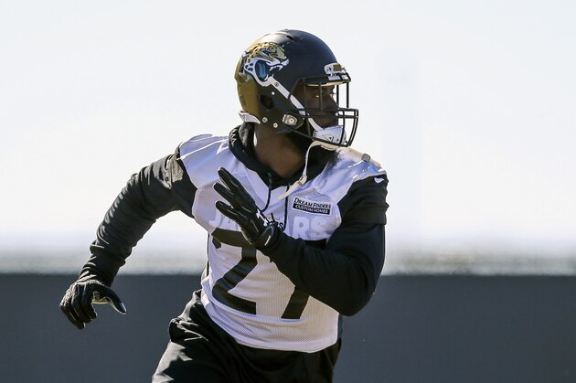 Jacksonville Jaguars running back Leonard Fournette (27) takes part in a drill during an NFL football practice in Jacksonville, Fla., Thursday, Jan. 18, 2018. (AP Photo/Gary McCullough)