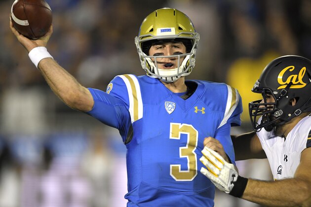 UCLA quarterback Josh Rosen, left, passes before being hit by California's Tony Mekari during the first half of an NCAA college football game, Friday, Nov. 24, 2017, in Los Angeles. (AP Photo/Mark J. Terrill)