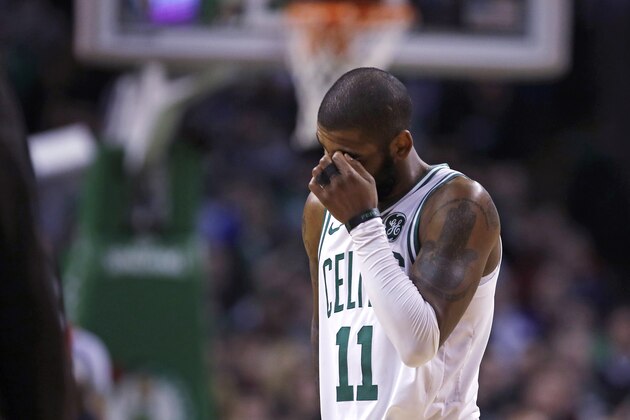 Boston Celtics guard Kyrie Irving (11) heads to the bench after missing a 3-point attempt during the final minute overtime of an NBA basketball game against the New Orleans Pelicans in Boston, Tuesday, Jan. 16, 2018. The Pelicans defeated the Celtics 116-113. (AP Photo/Charles Krupa)