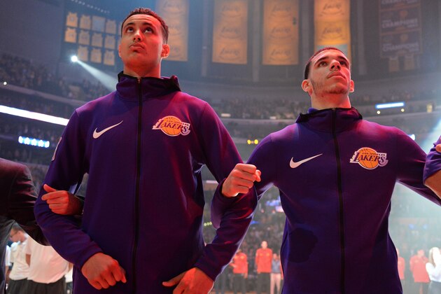 LOS ANGELES, CA - JANUARY 7:  Kyle Kuzma #0 and Lonzo Ball #2 of the Los Angeles Lakers stand on the court for the National Anthem before the game against the Atlanta Hawks on January 7, 2018 at STAPLES Center in Los Angeles, California. NOTE TO USER: User expressly acknowledges and agrees that, by downloading and/or using this Photograph, user is consenting to the terms and conditions of the Getty Images License Agreement. Mandatory Copyright Notice: Copyright 2018 NBAE (Photo by Andrew D. Bernstein/NBAE via Getty Images)