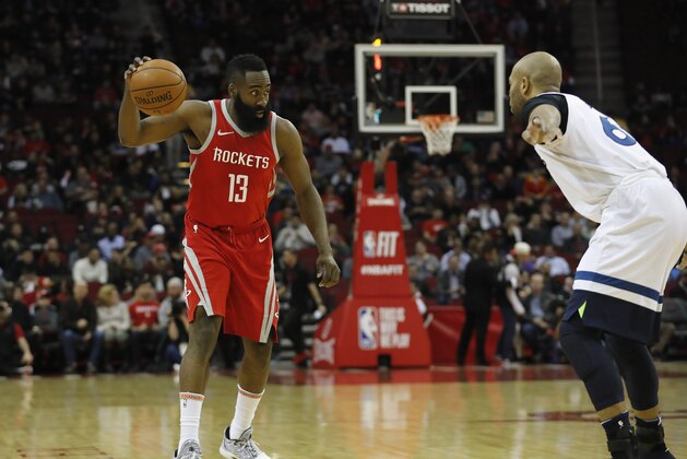 HOUSTON, TX - JANUARY 18:  James Harden #13 of the Houston Rockets controls the ball defended by Taj Gibson #67 of the Minnesota Timberwolves in the first half at Toyota Center on January 18, 2018 in Houston, Texas.  NOTE TO USER: User expressly acknowledges and agrees that, by downloading and or using this Photograph, user is consenting to the terms and conditions of the Getty Images License Agreement.  (Photo by Tim Warner/Getty Images)