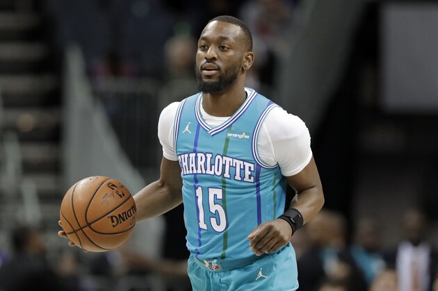 Charlotte Hornets' Kemba Walker (15) brings the ball up the court against the Oklahoma City Thunder during the first half of an NBA basketball game in Charlotte, N.C., Saturday, Jan. 13, 2018. (AP Photo/Chuck Burton)