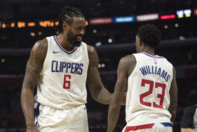 Los Angeles Clippers center DeAndre Jordan, left, and guard Lou Williams during the first half of an NBA basketball game Wednesday, Dec. 6, 2017, in Los Angeles. (AP Photo/Kyusung Gong)