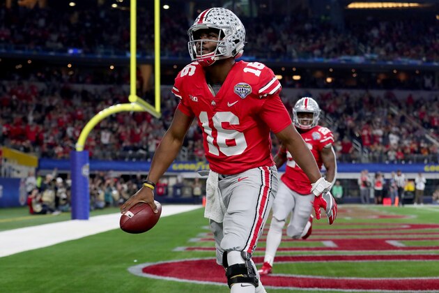 ARLINGTON, TX - DECEMBER 29:  J.T. Barrett #16 of the Ohio State Buckeyes celebrates after scoring a touchdown against the USC Trojans in the first half during the Goodyear Cotton Bowl Classic at AT&T Stadium on December 29, 2017 in Arlington, Texas.  (Photo by Tom Pennington/Getty Images)