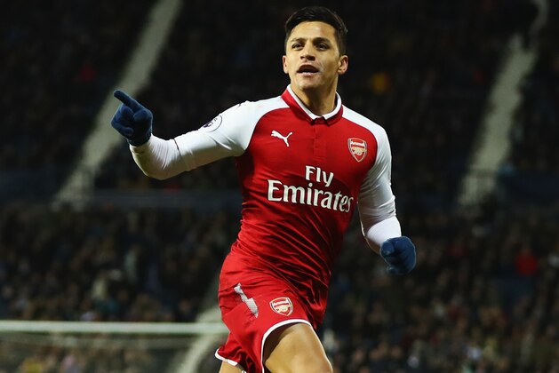 WEST BROMWICH, ENGLAND - DECEMBER 31: Alexis Sanchez of Arsenal celebrates as his free kick deflects off James McClean of West Bromwich Albion for their first goal during the Premier League match between West Bromwich Albion and Arsenal at The Hawthorns on December 31, 2017 in West Bromwich, England. (Photo by Michael Steele/Getty Images) WEST BROMWICH, ENGLAND - DECEMBER 31: Alexis Sanchez of Arsenal celebrates as his free kick deflects off James McClean of West Bromwich Albion for their first goal during the Premier League match between West Bromwich Albion and Arsenal at The Hawthorns on December 31, 2017 in West Bromwich, England. (Photo by Michael Steele/Getty Images)