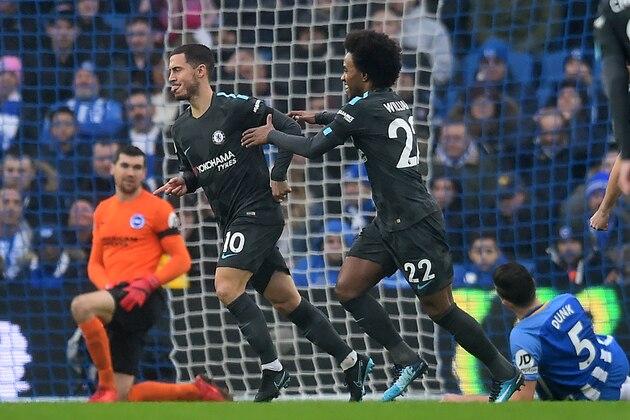 Chelsea's Belgian midfielder Eden Hazard (2nd L) celebrates with Chelsea's Brazilian midfielder Willian after scoring the opening goal of the English Premier League football match between Brighton and Hove Albion and Chelsea at the American Express Community Stadium in Brighton, southern England on January 20, 2018. / AFP PHOTO / Glyn KIRK / RESTRICTED TO EDITORIAL USE. No use with unauthorized audio, video, data, fixture lists, club/league logos or 'live' services. Online in-match use limited to 75 images, no video emulation. No use in betting, games or single club/league/player publications.  /         (Photo credit should read GLYN KIRK/AFP/Getty Images)