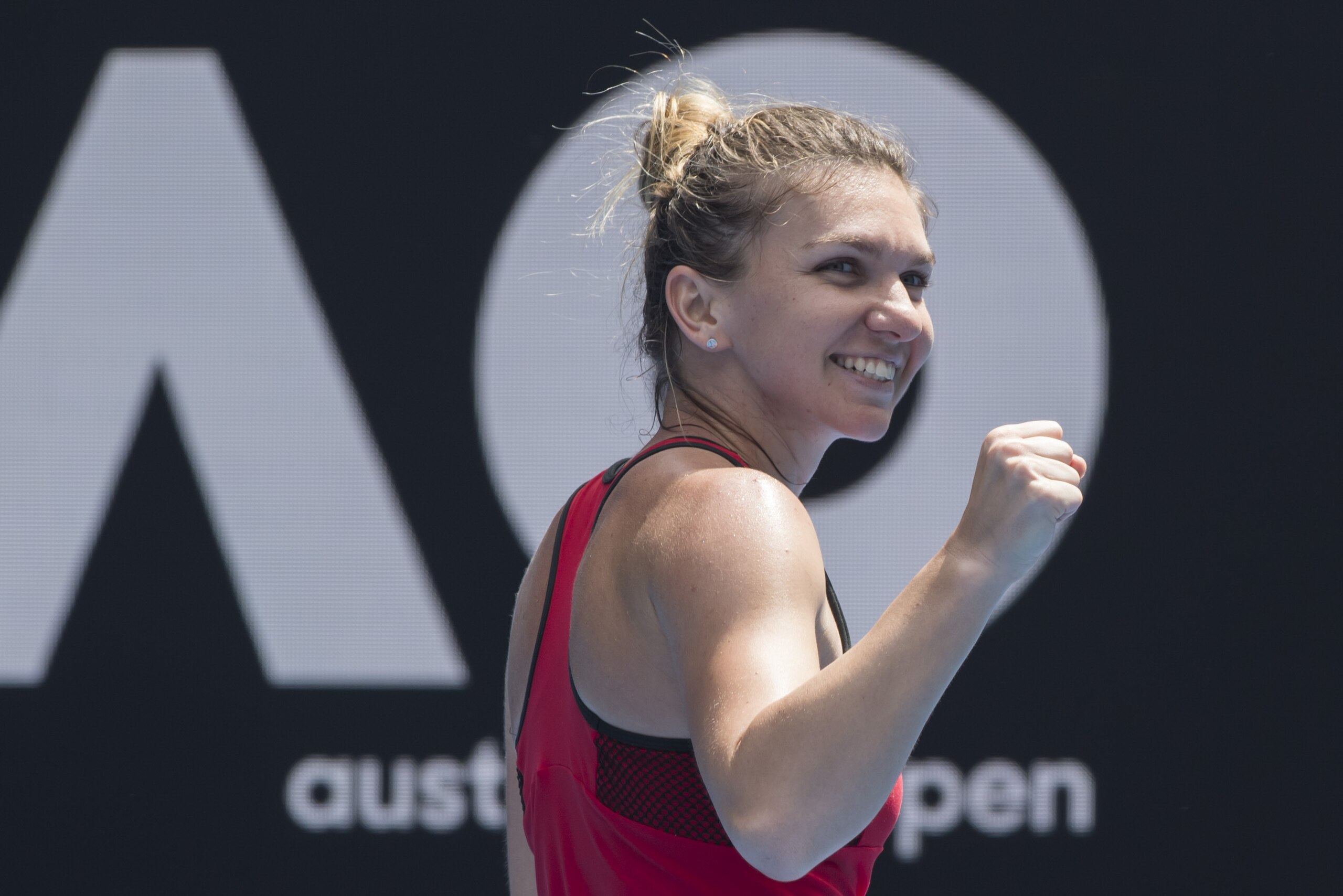MELBOURNE, AUSTRALIA - JANUARY 20:  Simona Halep of Romania celebrates victory in her 3 hour 45 minute match against Lauren Davis of the United States on day six of the 2018 Australian Open at Melbourne Park on January 20, 2018 in Melbourne, Australia.  (Photo by James D. Morgan/Getty Images)