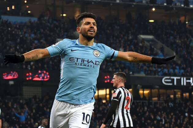 Manchester City's Argentinian striker Sergio Aguero celebrates after scoring the opening goal of the English Premier League football match between Manchester City and Newcastle United at the Etihad Stadium in Manchester, north west England, on January 20, 2018. / AFP PHOTO / PAUL ELLIS / RESTRICTED TO EDITORIAL USE. No use with unauthorized audio, video, data, fixture lists, club/league logos or 'live' services. Online in-match use limited to 75 images, no video emulation. No use in betting, games or single club/league/player publications.  /         (Photo credit should read PAUL ELLIS/AFP/Getty Images)