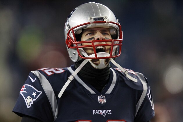 New England Patriots quarterback Tom Brady (12) runs onto the field prior to an NFL divisional playoff football game against the Tennessee Titans, Saturday, Jan. 13, 2018, in Foxborough, Mass. . (AP Photo/Stew Milne)