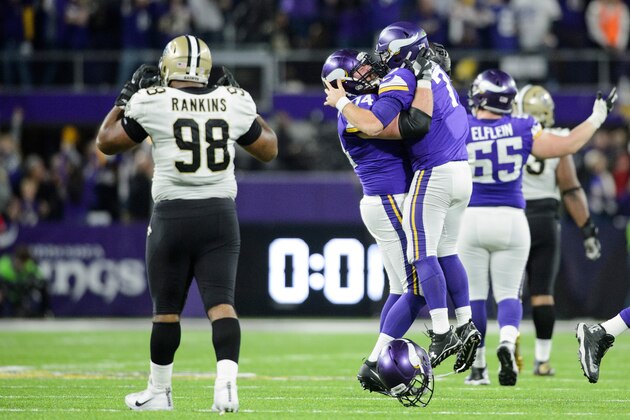 MINNEAPOLIS, MN - JANUARY 14: Mike Remmers #74 and Case Keenum #7 of the Minnesota Vikings celebrate a touchdown Sheldon Rankins #98 of the New Orleans Saints looks on during the second half of the NFC Divisional Playoff game on January 14, 2018 at U.S. Bank Stadium in Minneapolis, Minnesota. (Photo by Hannah Foslien/Getty Images)