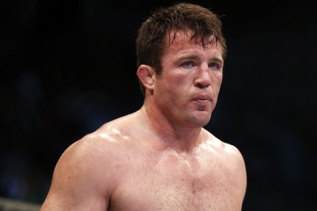 FILE - In this Aug. 17, 2013, file photo, Chael Sonnen looks on after his win against Mauricio 'Shogun' Rua, of Brazil, in their UFC mixed martial arts light heavyweight bout in Boston. Chael Sonnen is returning to mixed martial arts with the Bellator promotion, the veteran fighter tells The Associated Press. The 39-year-old Sonnen signed a multiyear, multi-fight deal with the UFC's largest competitor on Thursday night, Sept. 15, 2016.  (AP Photo/Gregory Payan, File)