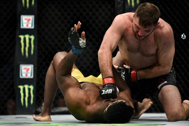 BOSTON, MA - JANUARY 20:  (R-L) Stipe Miocic punches Francis Ngannou of Cameroon in their heavyweight championship bout during the UFC 220 event at TD Garden on January 20, 2018 in Boston, Massachusetts. (Photo by Brandon Magnus/Zuffa LLC/Zuffa LLC via Getty Images)