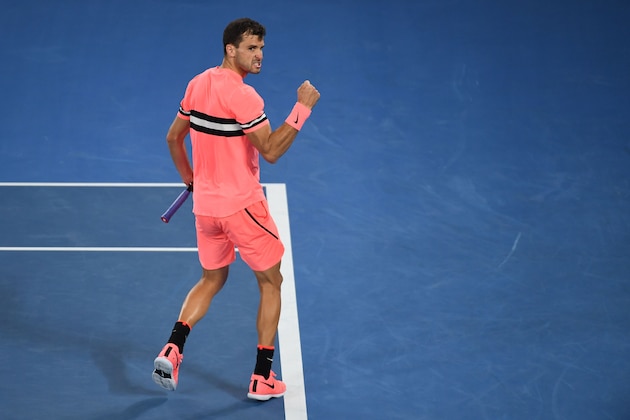 Bulgaria's Grigor Dimitrov reacts after a point against Australia's Nick Kyrgios during their men's singles fourth round match on day seven of the Australian Open tennis tournament in Melbourne on January 21, 2018. / AFP PHOTO / WILLIAM WEST / -- IMAGE RESTRICTED TO EDITORIAL USE - STRICTLY NO COMMERCIAL USE --        (Photo credit should read WILLIAM WEST/AFP/Getty Images)