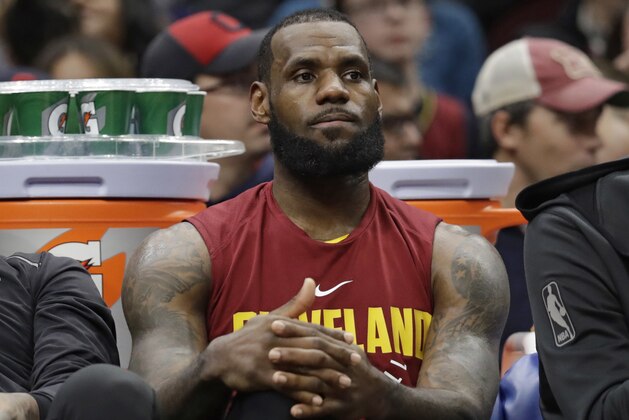 Cleveland Cavaliers' LeBron James sits on the bench in the second half of an NBA basketball game against the Oklahoma City Thunder, Saturday, Jan. 20, 2018, in Cleveland. (AP Photo/Tony Dejak)