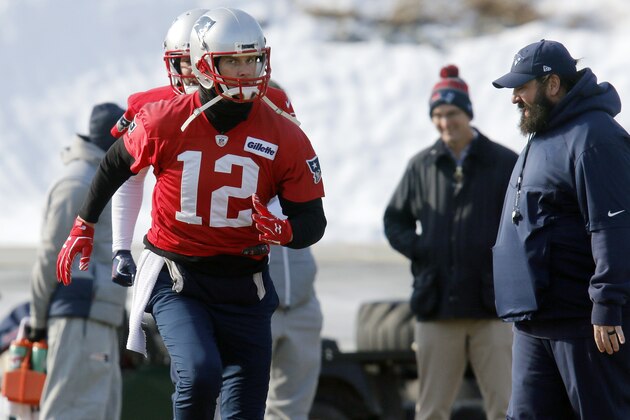 New England Patriots quarterback Tom Brady, left, warms up as defensive coordinator Matt Patricia, right, watches during an NFL football practice, Friday, Jan. 19, 2018, in Foxborough, Mass. The Patriots host the Jacksonville Jaguars in the AFC championship on Sunday in Foxborough.(AP Photo/Bill Sikes)